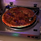 Illustration for article titled Report: Best Indicator Of Kickass Party Still Pizza Spinning On Turntable